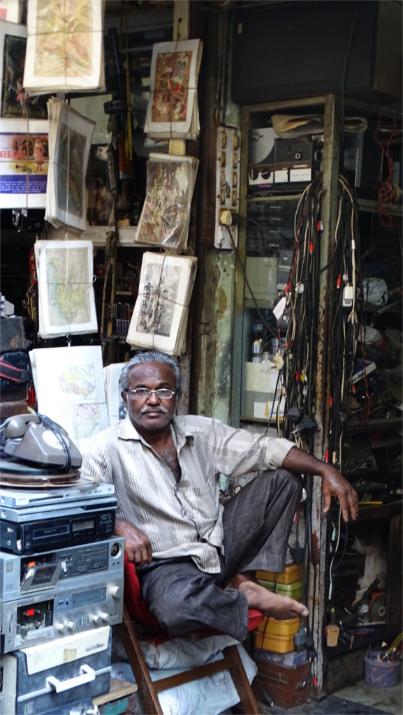 In Mumbai's Chor Bazaar, a shopkeeper waits for customers